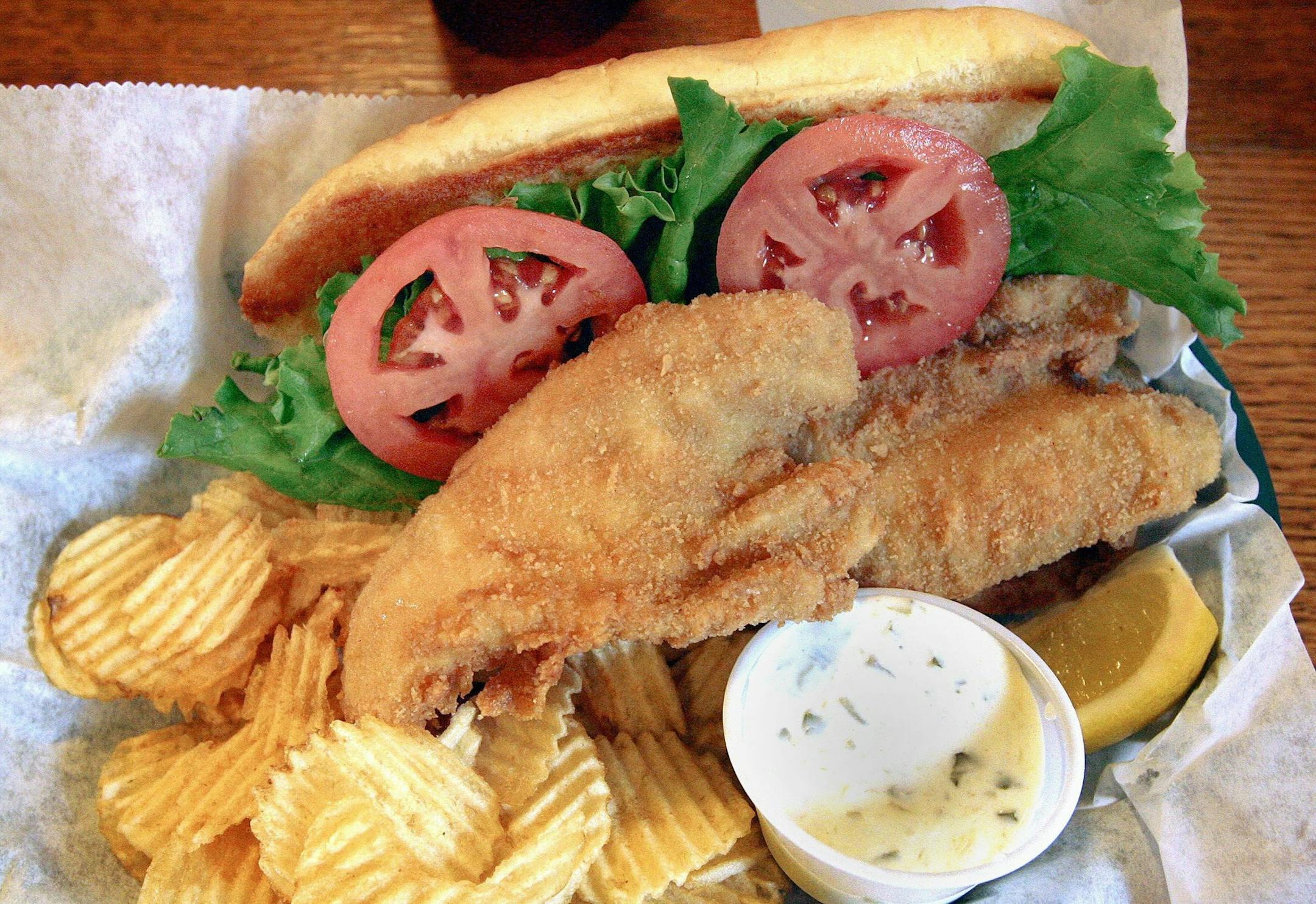 Walleyes that Mike Williams and friends caught the morning of Aug. 5, 2014 on Rainy Lake in Minn. were prepared in walleye sandwiches for lunch at the Kettle Falls Hotel at midday. (Sam Cook/Duluth News Tribune/MCT) ORG XMIT: 1156003