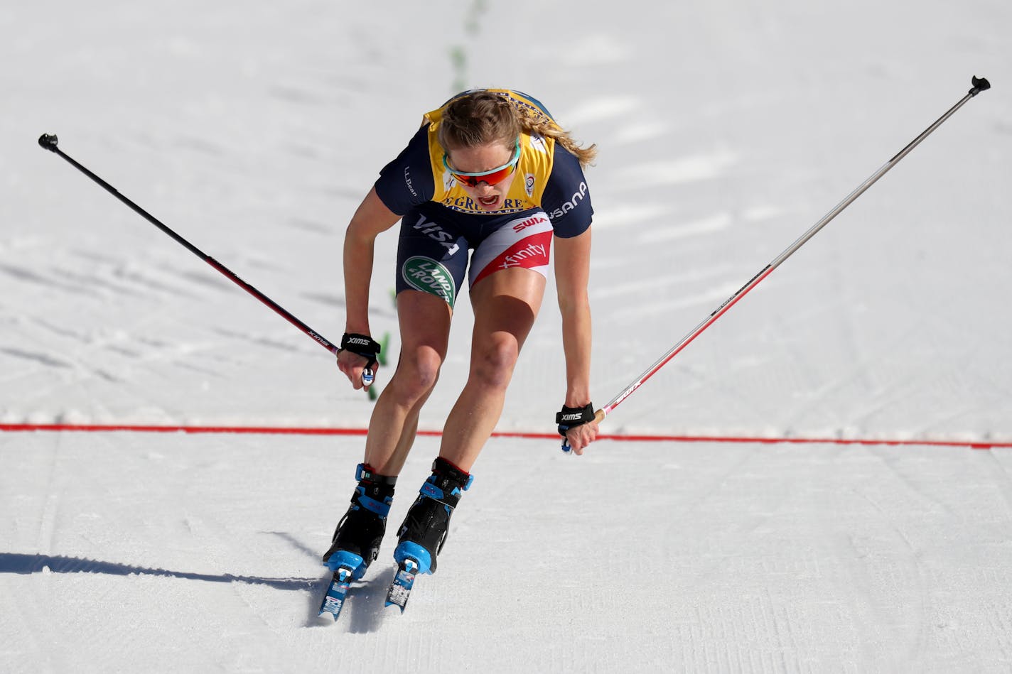 Jessie Diggins of the United States crosses the finish line during the 10km women's interval start free race at the FIS Nordic World Ski Championships in Oberstdorf, Germany, Tuesday, March 2, 2021. (AP Photo/Matthias Schrader)