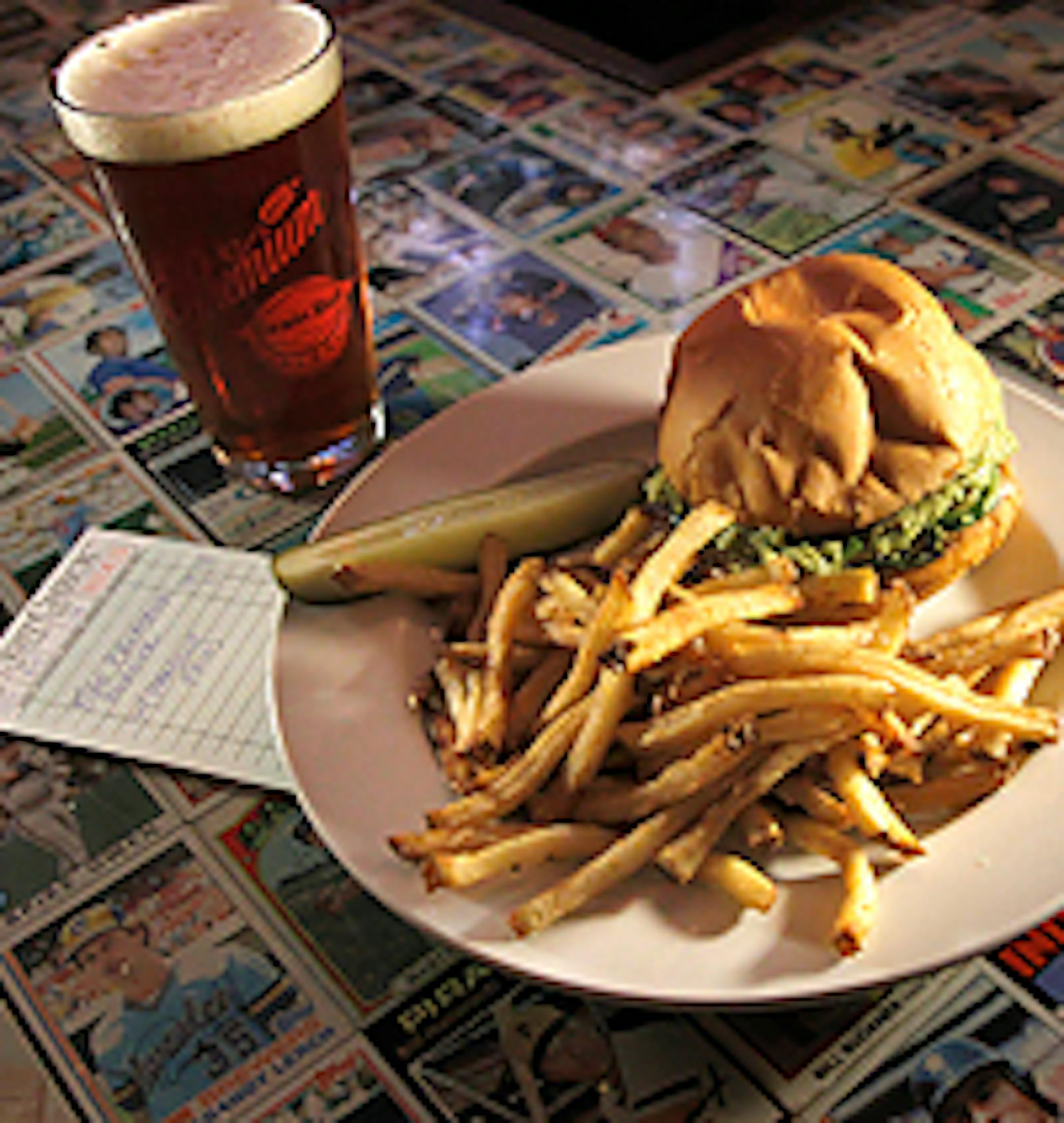 The Lowbrow's Fire Breather burger features a chili-rubbed grass-fed beef patty with chipotle gouda, sauteed jalape�os and guacamole