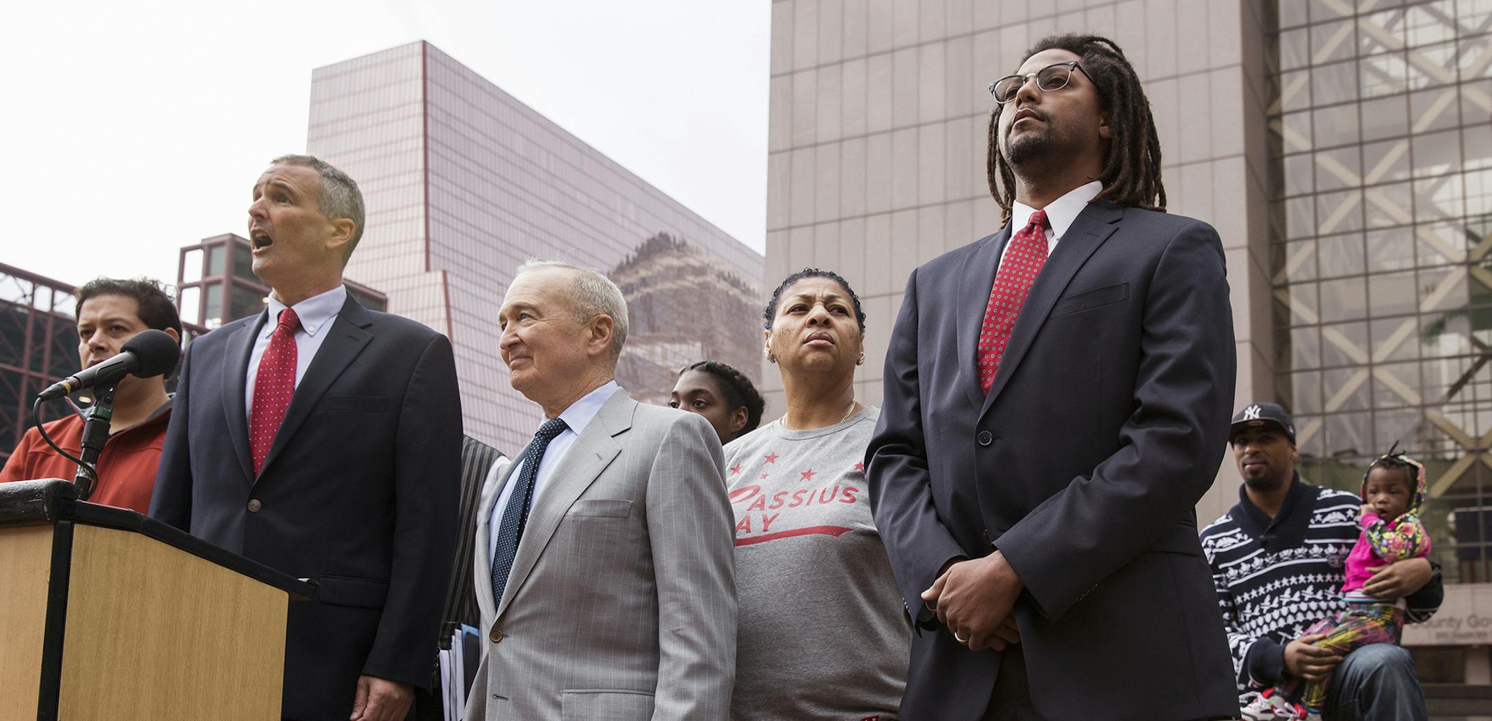 Attorneys John and Dan Shulman speak to the media, surrounded by plaintiffs in the case, during a press conference announcing a lawsuit against the state of Minnesota for allowing segregation in schools outside the Hennepin County Courthouse in downtown Minneapolis on Thursday, November 5, 2015. ] (LEILA NAVIDI/STAR TRIBUNE) leila.navidi@startribune.com BACKGROUND INFORMATION: Seven families are suing the state of Minnesota for allowing segregation of public schools and depriving families of an
