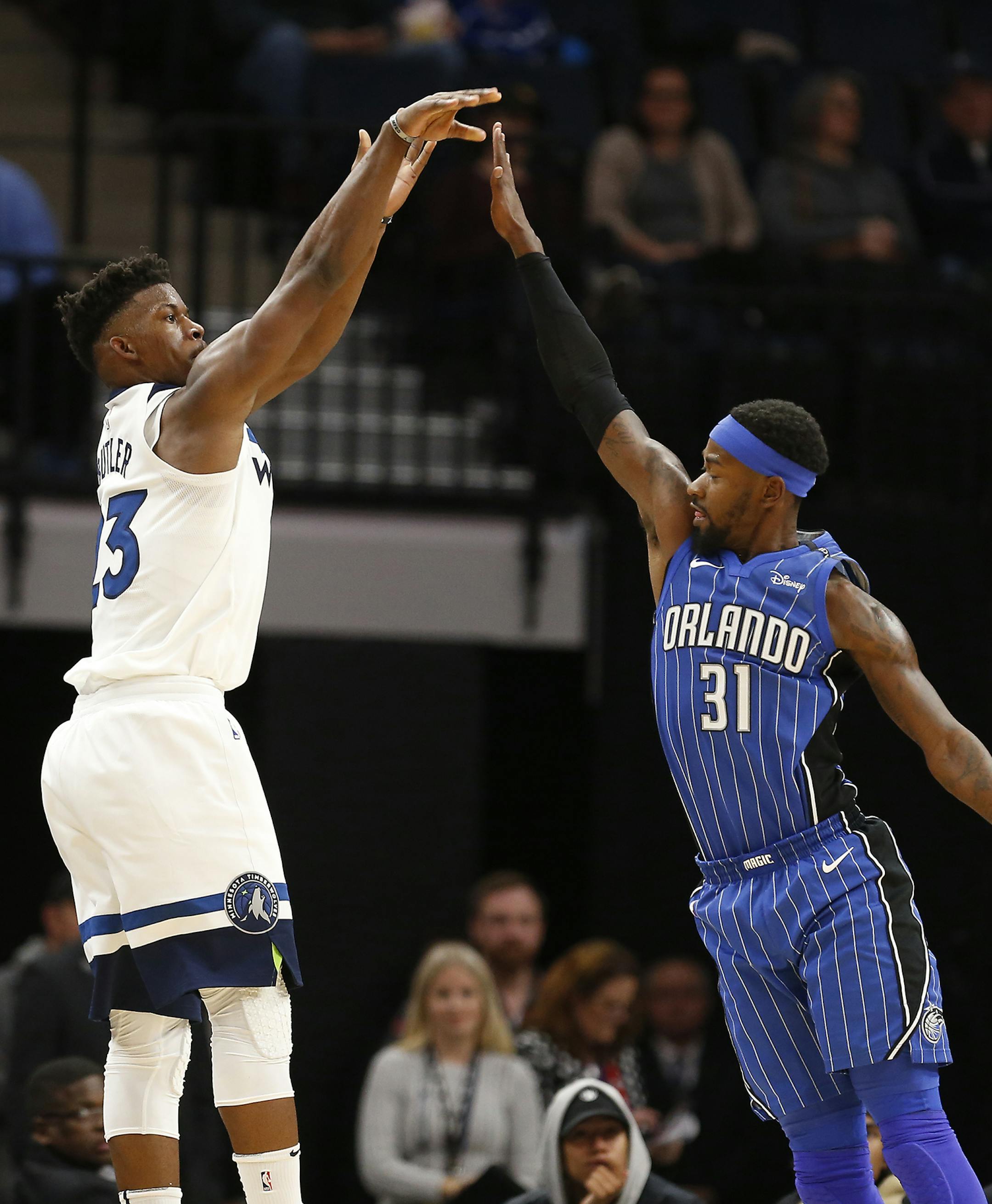 Minnesota Timberwolves guard Jimmy Butler (23) shoots as Orlando Magic guard Terrence Ross (31) defends during the second half. ] LEILA NAVIDI ï leila.navidi@startribune.com BACKGROUND INFORMATION: Minnesota Timberwolves against Orlando Magic at Target Center in Minneapolis on Wednesday, November 22, 2017.