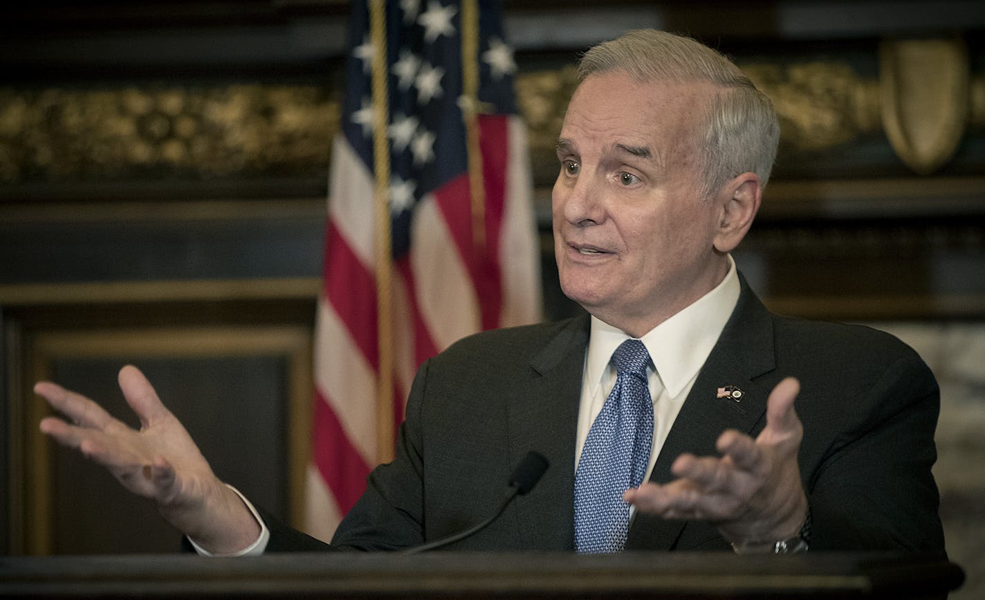 Gov. Mark Dayton, shown Friday, also used his power of line-item veto to strike out funding for the state House and Senate.