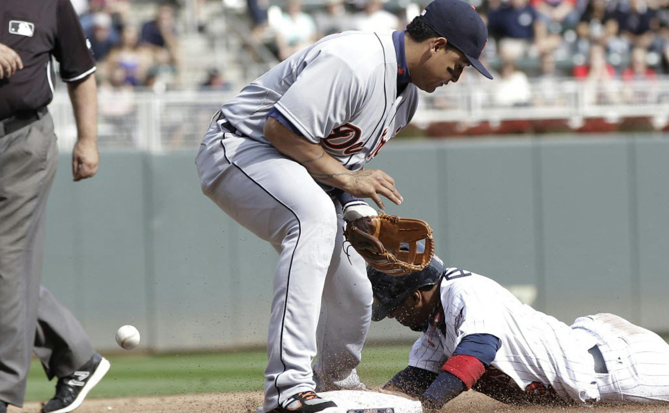 Detroit third baseman Miguel Cabrera couldn't handle the throw as the Twins' Alexi Casilla stole third in the fifth inning.