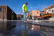 Joel Jordan cleaned part of the new plaza leading to the historic Stillwater Lift Bridge on Thursday. Portions of Main Street that have been closed du