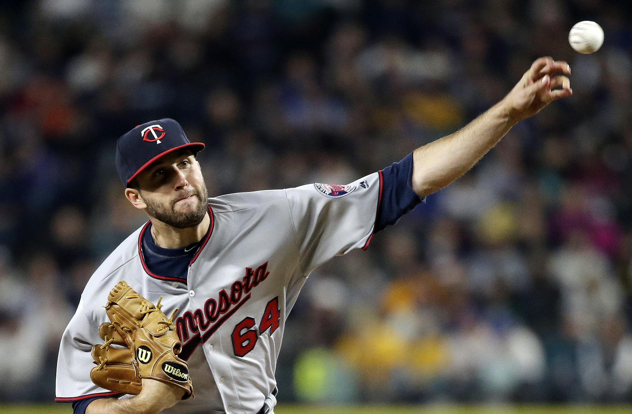 Minnesota Twins starting pitcher Pat Dean throws against the Seattle Mariners during the first inning of a baseball game Friday, May 27, 2016, in Seattle. (AP Photo/Elaine Thompson)