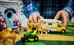 Todd Beyer, owner of the Wildwedge Golf, Mini-Golf and RV Park in Pequot Lakes, adjusted some of the camping toys in his display at the Minneapolis St