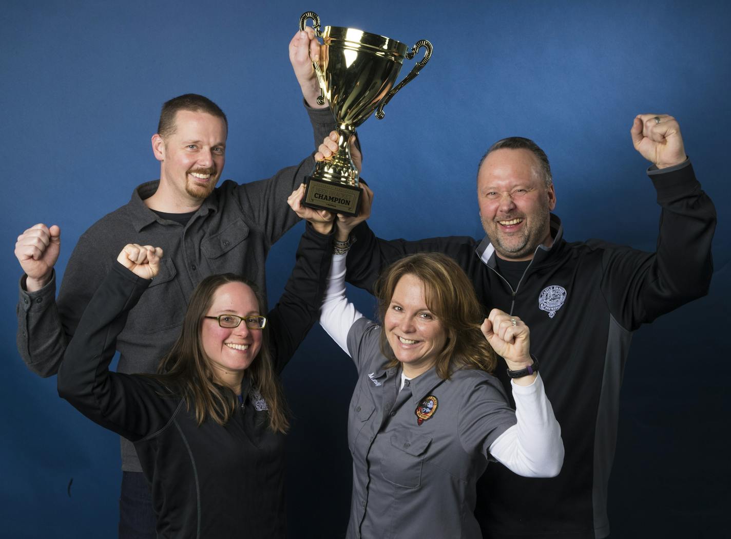 Castle Danger Brewery owners, from left to right, Clint MacFarlane, Jamie MacFarlane, Mandy Larson and Lon Larson held the Star Tribune Beer Bracket trophy for a photo on April 4, 2018 in Minneapolis, Minn. ] RENEE JONES SCHNEIDER &#x2022; renee.jones@startribune.com