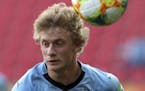 Uruguay's Thomas Chacon controls the ball during the Group C U20 World Cup soccer match between New Zealand and Uruguay, in Lodz, Poland, Thursday, Ma