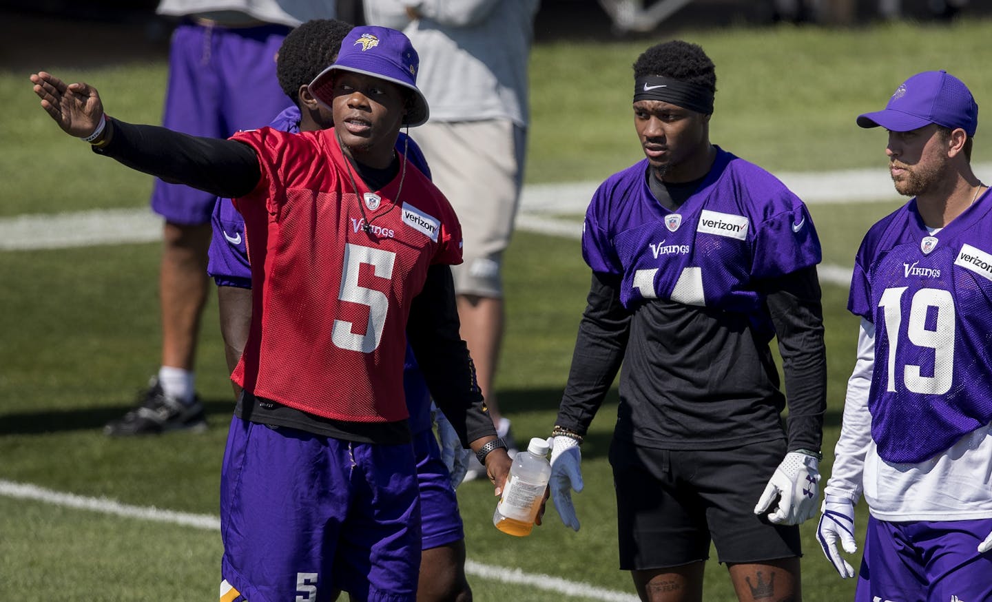 Teddy Bridgewater spoke to receivers Stefon Diggs and Adam Thielen during training camp.