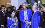 President Barack Obama, center, shakes hands with Malaysia&#x2019;s Prime Minister Najib Razak, right, as Najib's wife Rosmah Mansor watches at left a