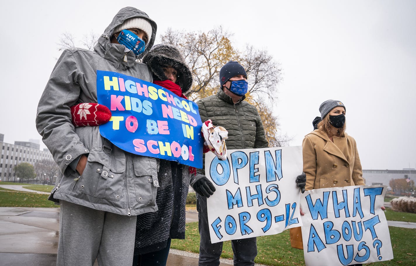 Tori McKinney, from left, 14, a ninth-grader at Minnetonka High School doing majority distance learning, stood with her mother, Jenny, during the news conference Monday where Republicans announced a "Contract to Open Up Minnesota" outside the State Capitol in St. Paul.