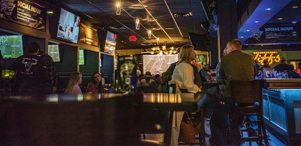 Tiffany Lounge on Ford Parkway had its share of patrons because bars shut down under Governor Walz's orders.] With bars closing down Friday at midnigh