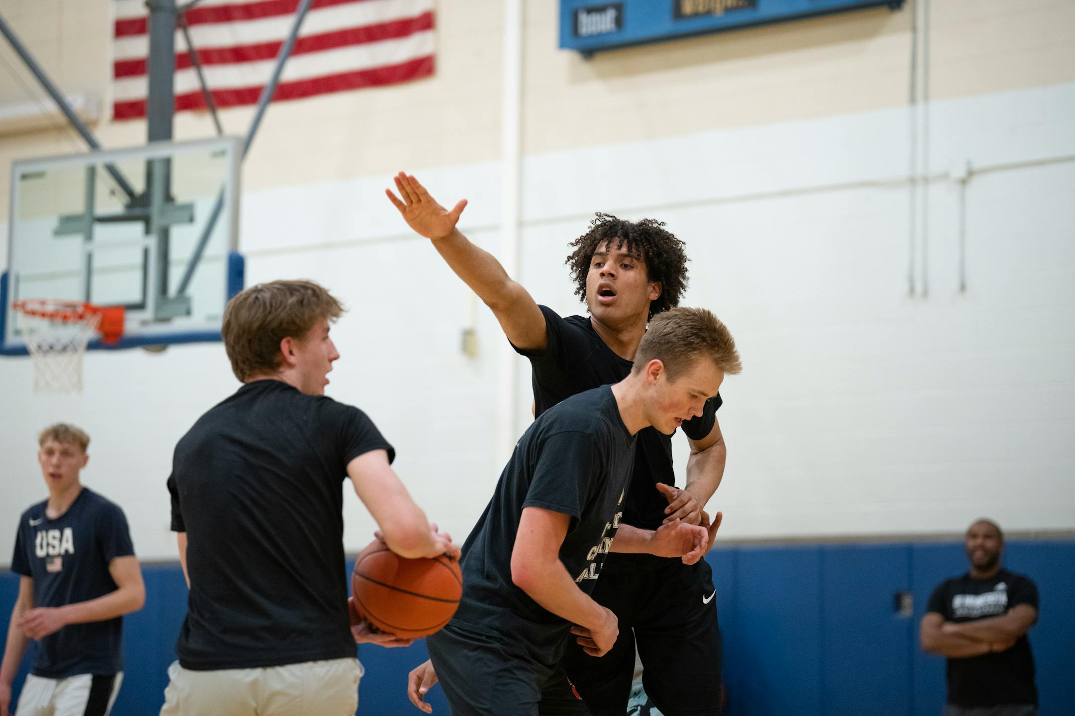 Isaiah Johnson reached over Grayson Grove to defend during practice at Wayzata Central Middle School in Plymouth.
