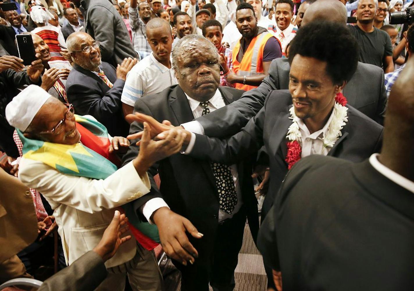 Oromo (Ethiopian) Olympian Feyisa Lilesa entered the Minneapolis Convention Center Sunday, Sept 18, 2016 to a crowd of about 1000 well wishers. He won the silver medal in the 2016 Games in Rio and crossed the finish line with his arms crossed in an X, symbolizing the plight of the Oromo in Ethiopia. 2016