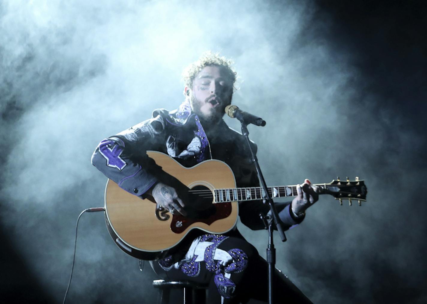 Post Malone performs a medley at the 61st annual Grammy Awards on Sunday, Feb. 10, 2019, in Los Angeles. (Photo by Matt Sayles/Invision/AP)