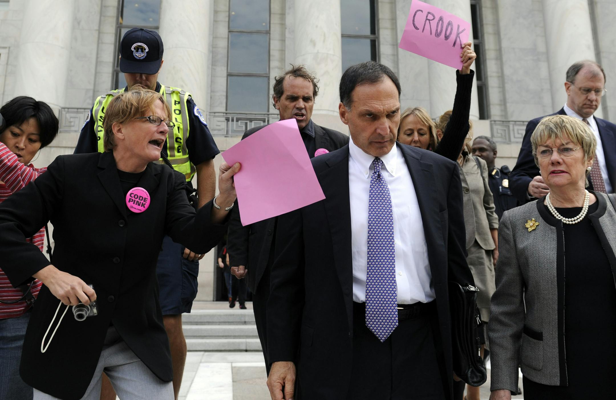 Lehman Brothers Holdings Inc. Chief Executive Richard S. Fuld Jr., wearing tie, is heckled by protesters as he leaves Capitol Hill in Washington after testify before the House Oversight and Government Reform Committee Monday, Oct. 6, 2008, on the collapse of Lehman Brothers. (AP Photo/Susan Walsh) ORG XMIT: MIN2013091116535437