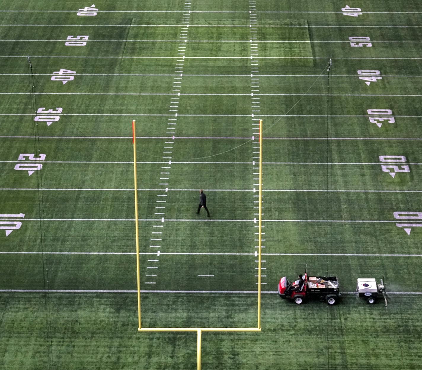 Vikings logos have been erased from the stadium in preparation for the Super Bowl. Work started right after Sunday's win over New Orleans.