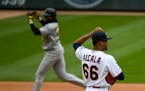 Minnesota Twins pitcher Jorge Alcala watches Pittsburgh Pirates Gregory Polanco round the bases after Polanco hit a home run during the eighth inning 