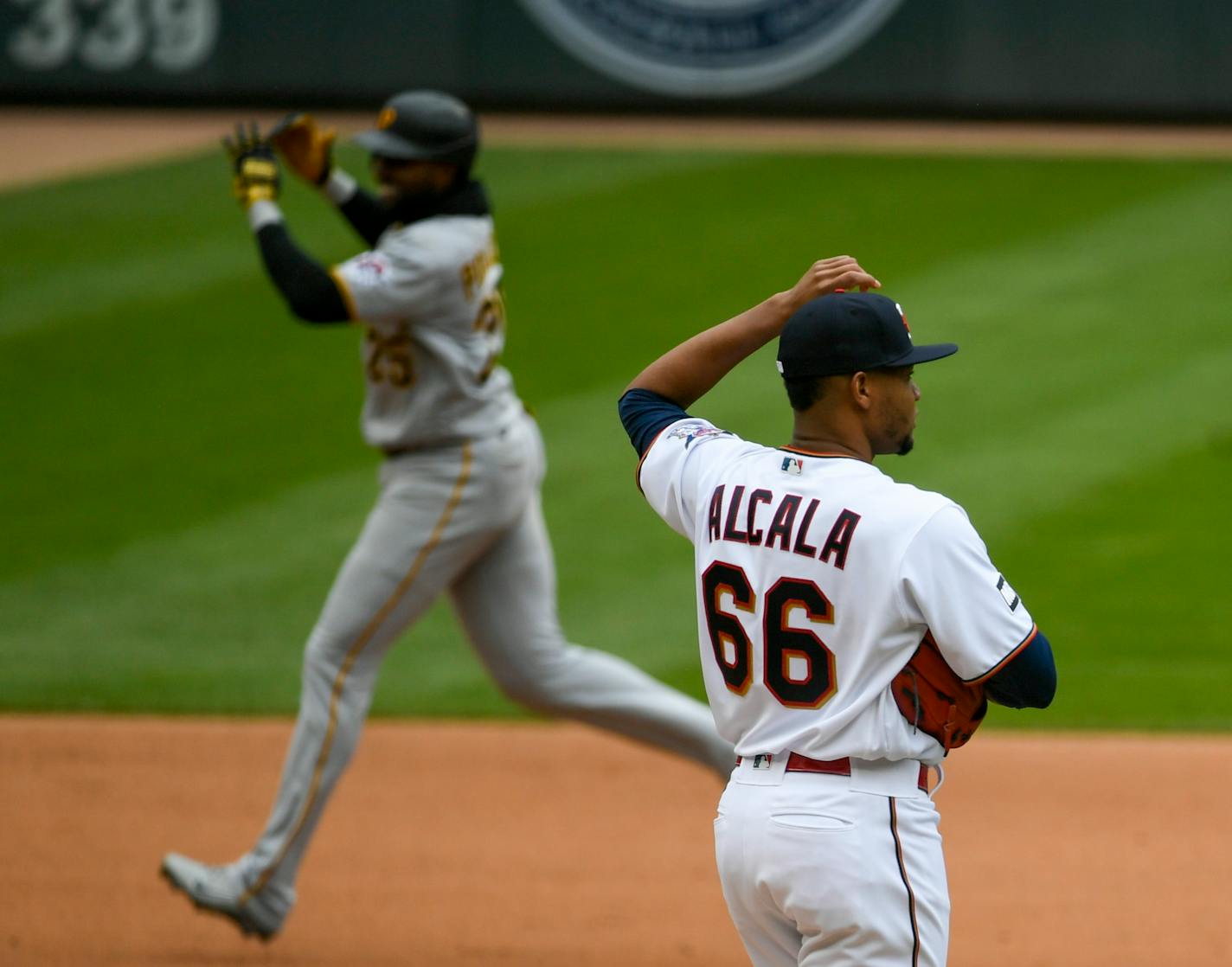 Minnesota Twins pitcher Jorge Alcala watches Pittsburgh Pirates Gregory Polanco round the bases after Polanco hit a home run during the eighth inning of a baseball game, Sunday, April 25, 2021, in Minneapolis. Pirates won 6-2. (AP Photo/Craig Lassig)