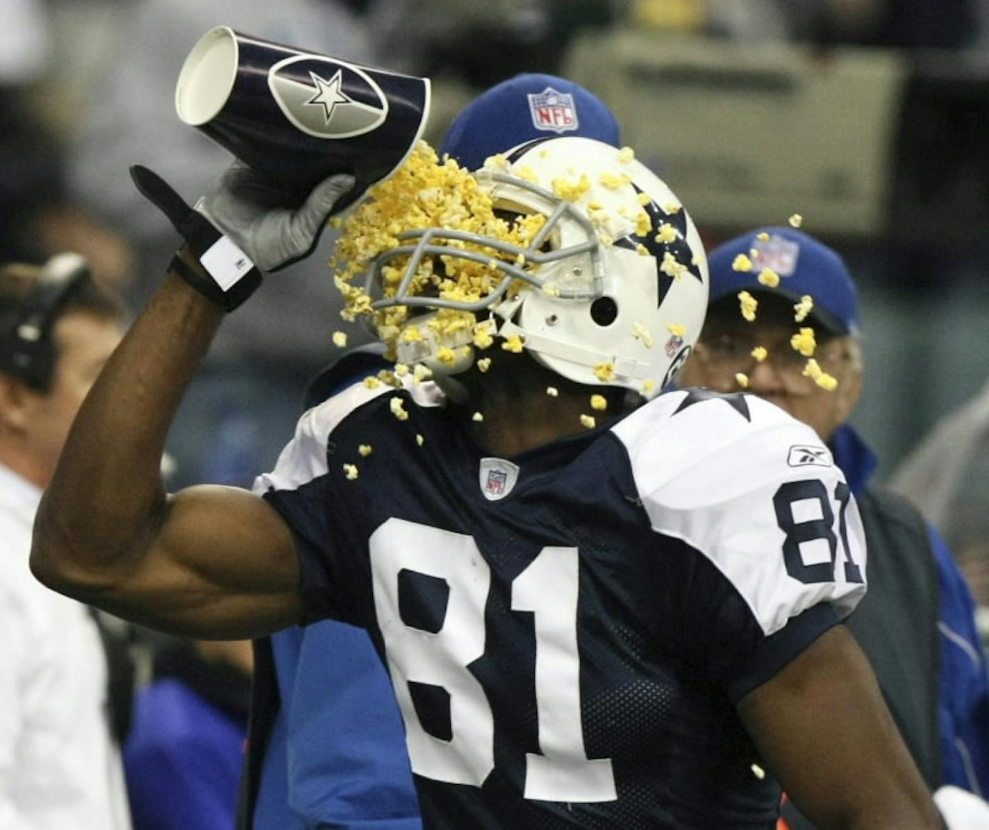 Terrell Owens throws popcorn in his face after scoring a touchdown vs. Green Bay in 2007.