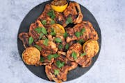 Grilled Spice-Rubbed Chicken Thighs with Lemon and Herbs. Recipe and photo by Meredith Deeds, Special to the Star Tribune