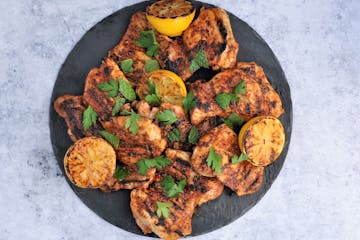 Grilled Spice-Rubbed Chicken Thighs with Lemon and Herbs. Recipe and photo by Meredith Deeds, Special to the Star Tribune