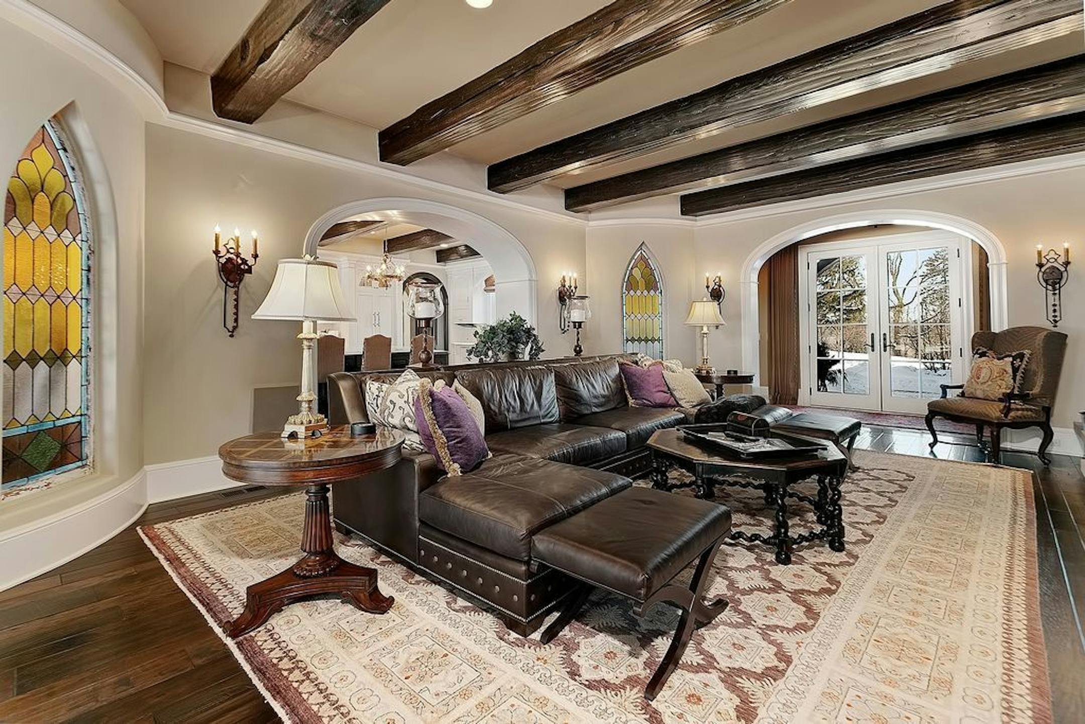Stained-glass windows from a church were repurposed in the family room.