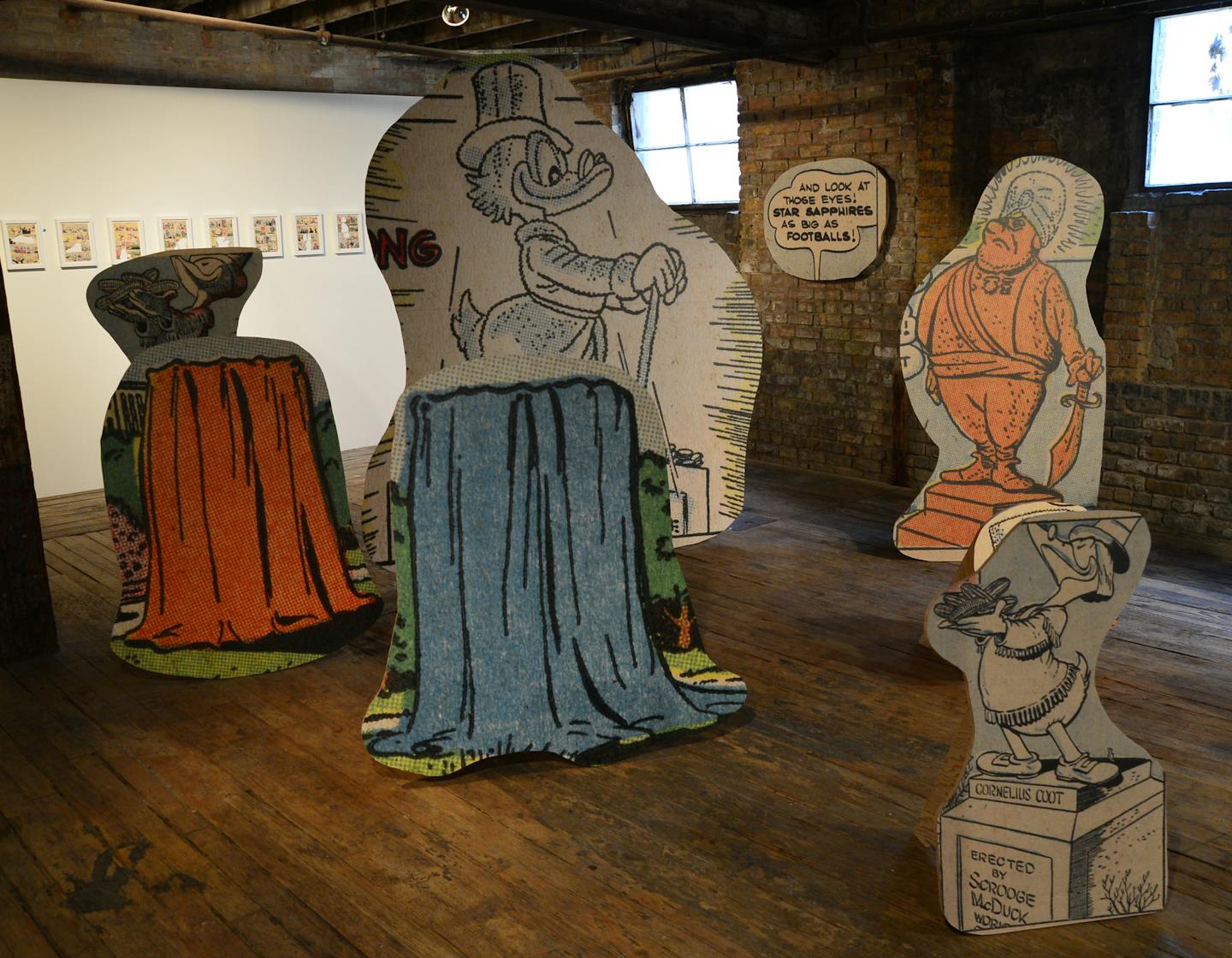 Minnesota Biennial at the Soap Factory,(Scrooge McDuck plywood pieces) Broc Blegen, Allen Ruppersberg, Big Trouble, 2010/2013, 10 framed pigment prints on paper with cutouts and 15 standing sculptures of pigment on plywood] Richard.Sennott@startribune.com Richard Sennott/Star Tribune Minneapolis Minnesota Friday 9/6/13) ** (cq)