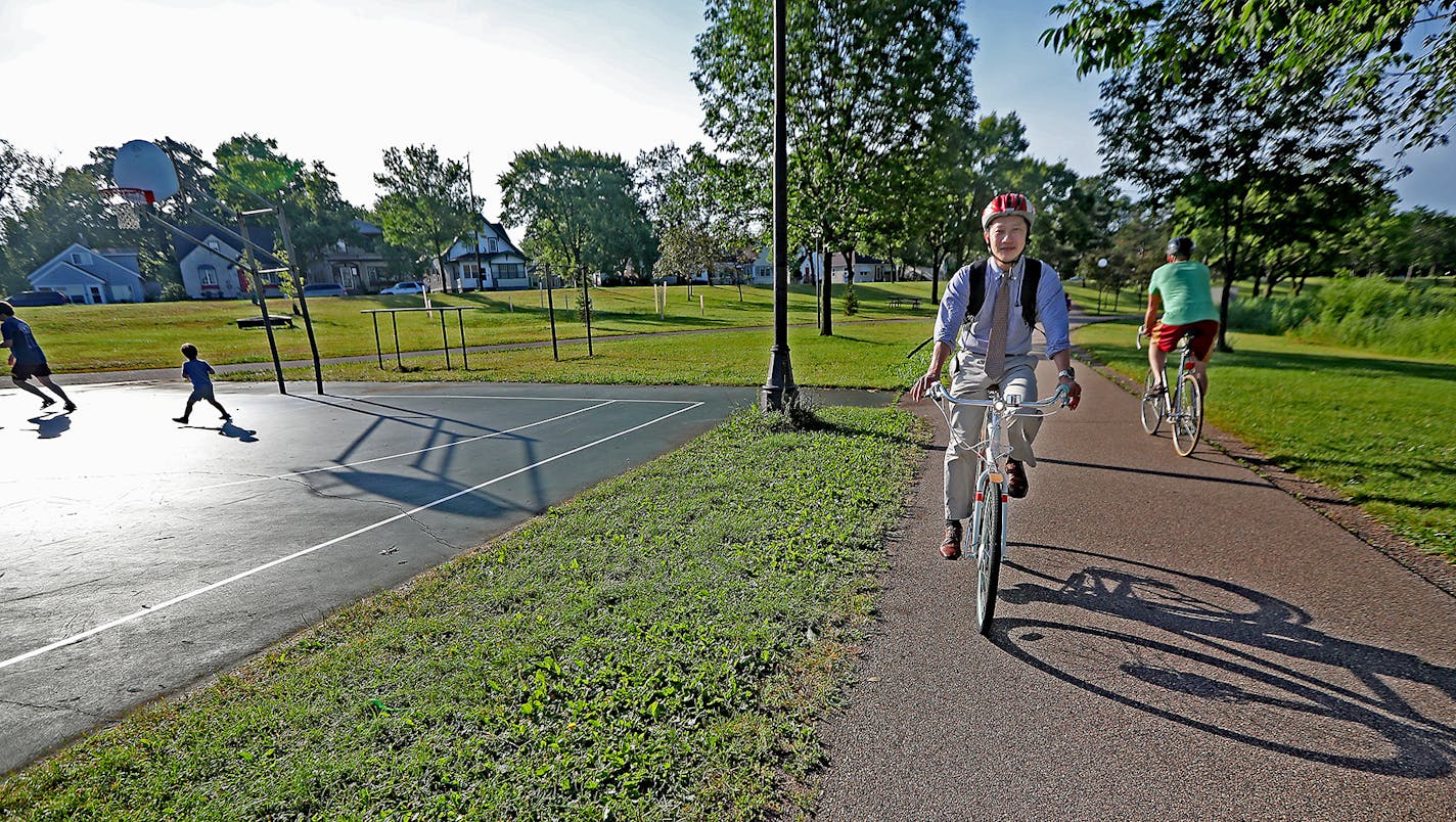 Rev. David Shinn, the associate pastor for congregational care at Westminster Presbyterian in Minneapolis, made his way along the bike path at Lake Hiawatha before a morning meeting, Wednesday, June 6, 2016 in Minneapolis, MN. ] (ELIZABETH FLORES/STAR TRIBUNE) ELIZABETH FLORES &#x2022; eflores@startribune.com