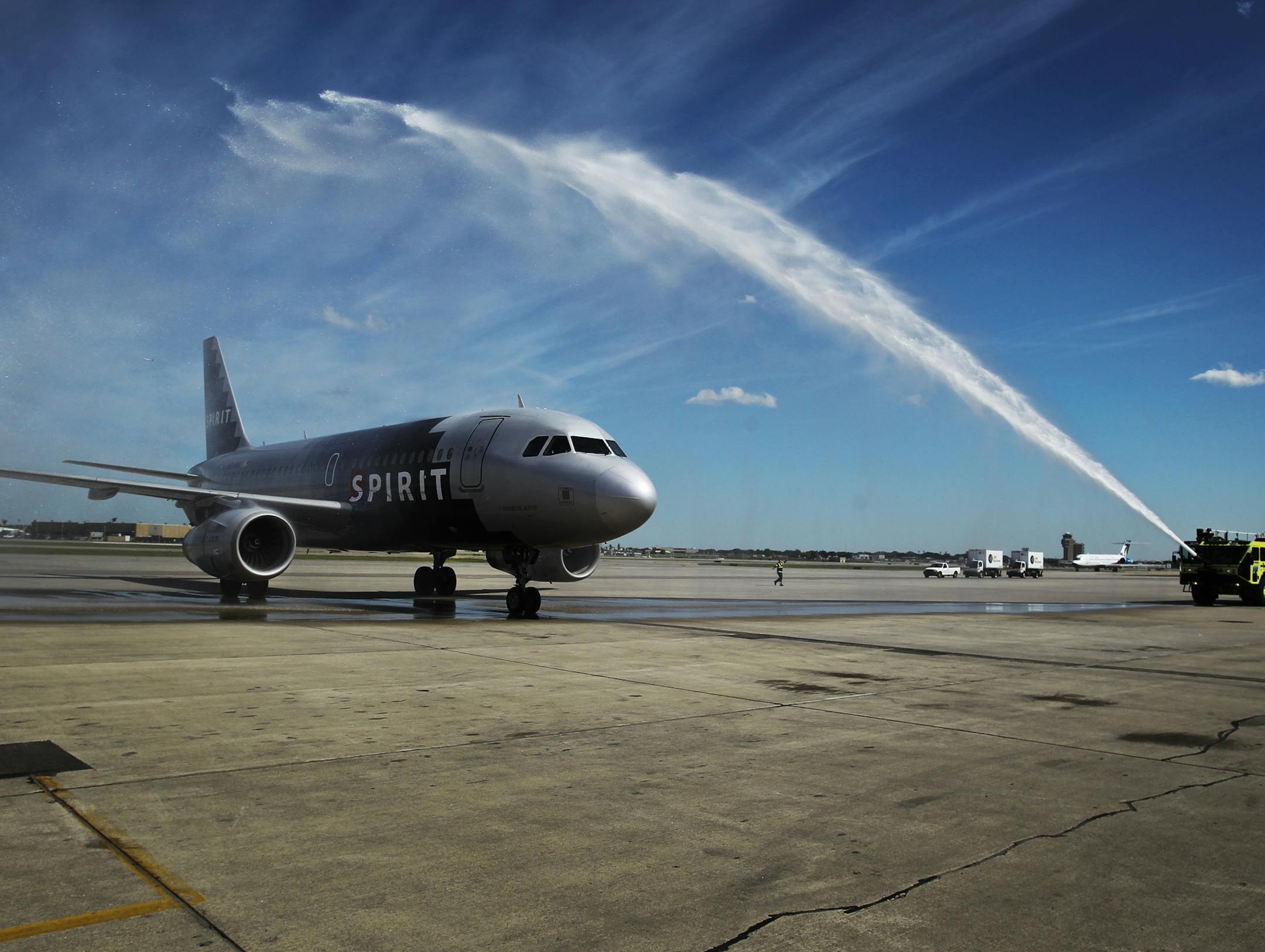 A Spirit Airlines jet arrives from Chicago to a "water salute" from an airport firetruck at MSP-terminal 2, after launching service with flights to Las Vegas and Chicago out of Minneapolis-St. Paul International Airport this week.] (DAVID JOLES/STARTRIBUNE) djoles@startribune.com Friday, June 1, 2012, in , Minneapolis MN. Spirit Airlines launches flights to Las Vegas and Chicago out of Minneapolis-St. Paul International Airport this week. ORG XMIT: MIN2013090612294421