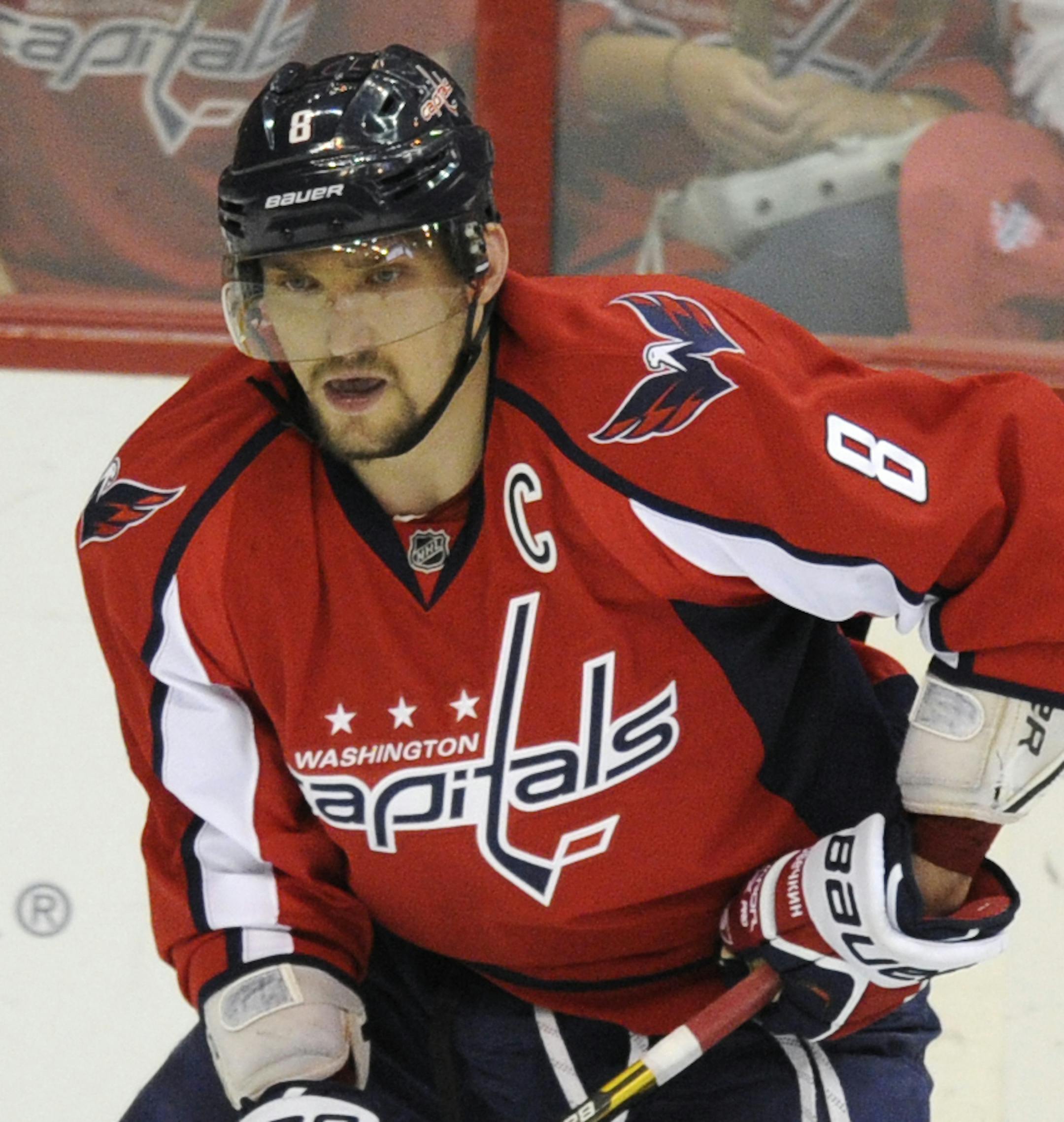 Washington Capitals left wing Alex Ovechkin (8), of Russia, skates with the puck against the Boston Bruins during the overtime period of an NHL hockey game, Saturday, April 27, 2013, in Washington. (AP Photo/Nick Wass)