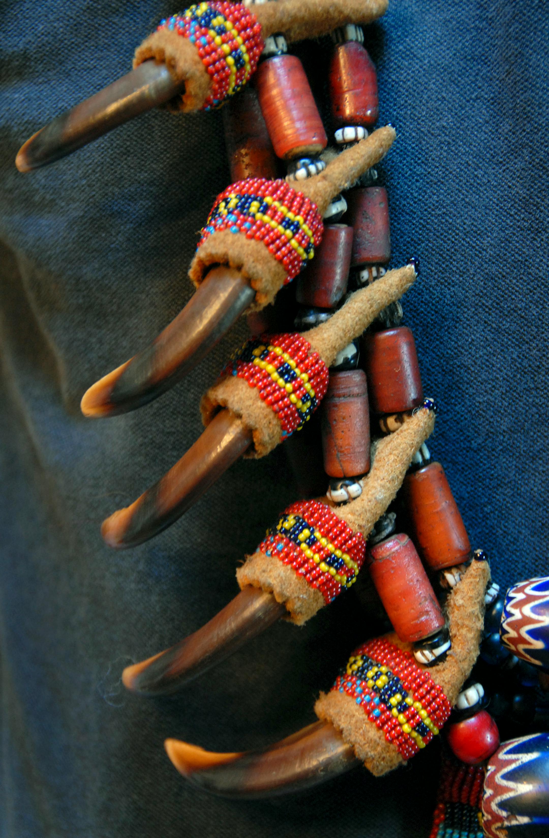 Bear-claw neck piece.