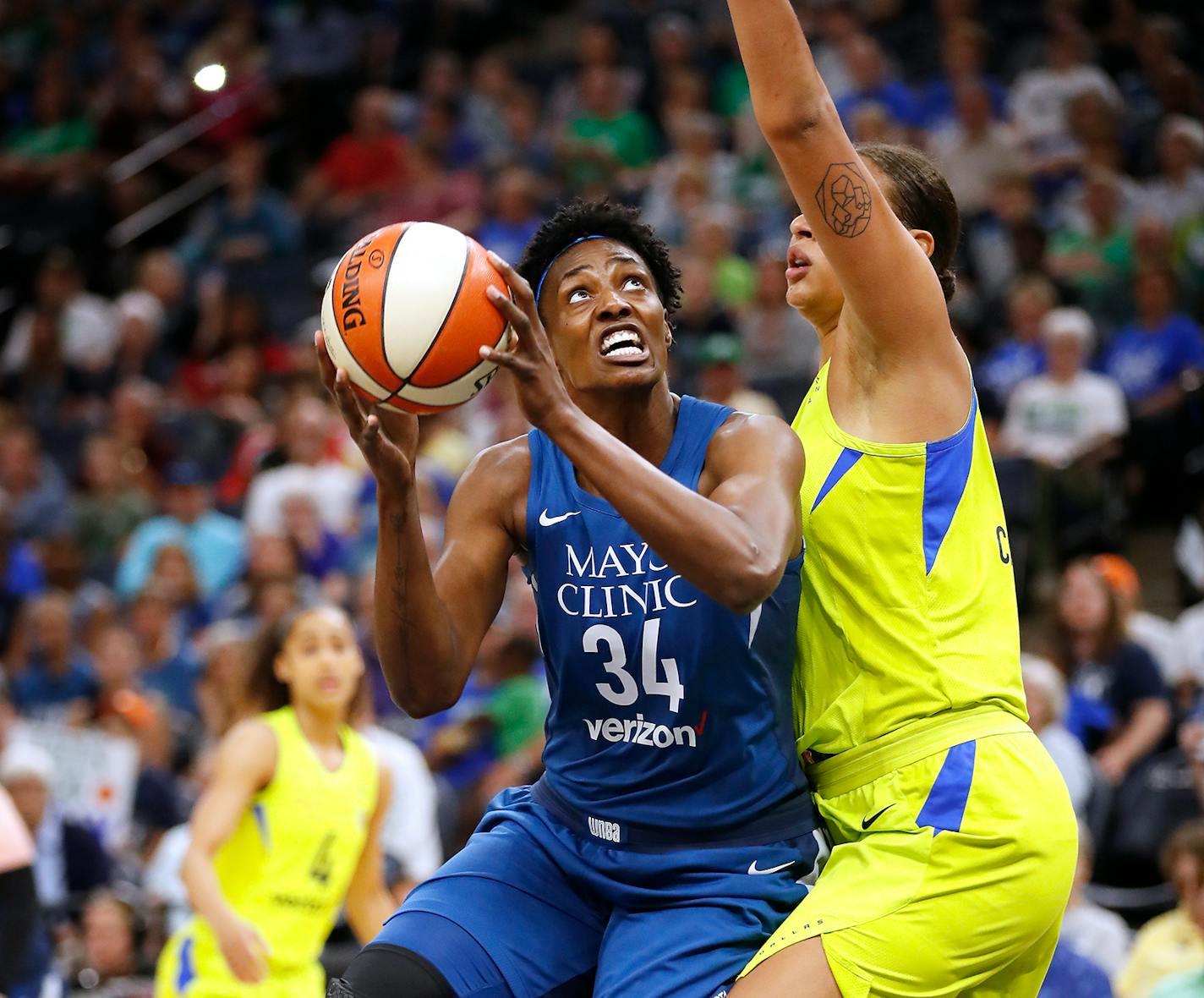 Lynx center Sylvia Fowles shoots against Dallas Wings center Elizabeth Cambage during the first half Wednesday.