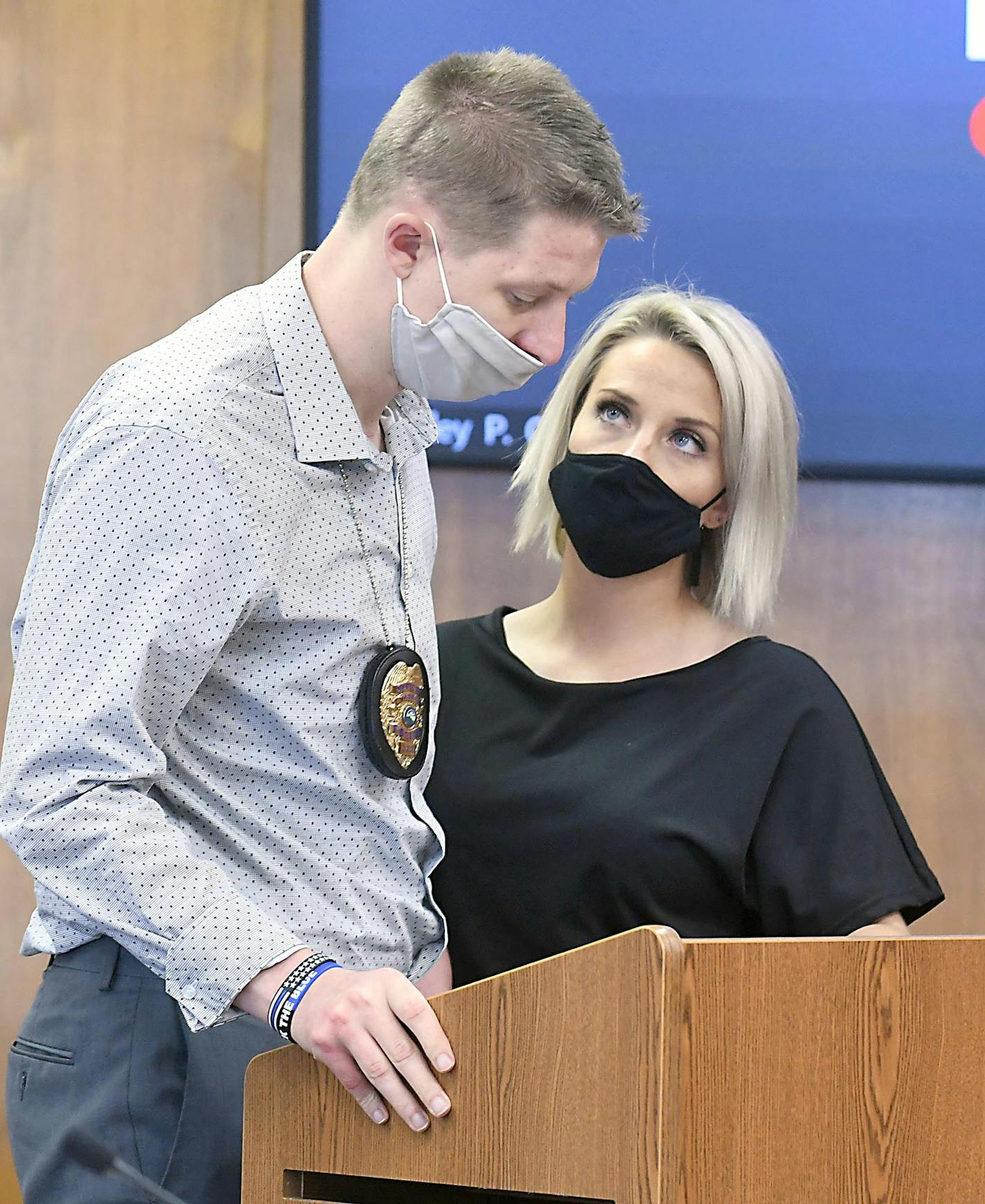 Waseca Police officer Arik Matson is steadied by his wife Megan as he reads a statement at Tyler Janovsky's sentencing hearing Friday at the Waseca County Courthouse. Janovsky was sentenced to 35 years in prison in Waseca County District Court for shooting Matson in the head on Jan. 6 after officers were called to a suspicious person call.