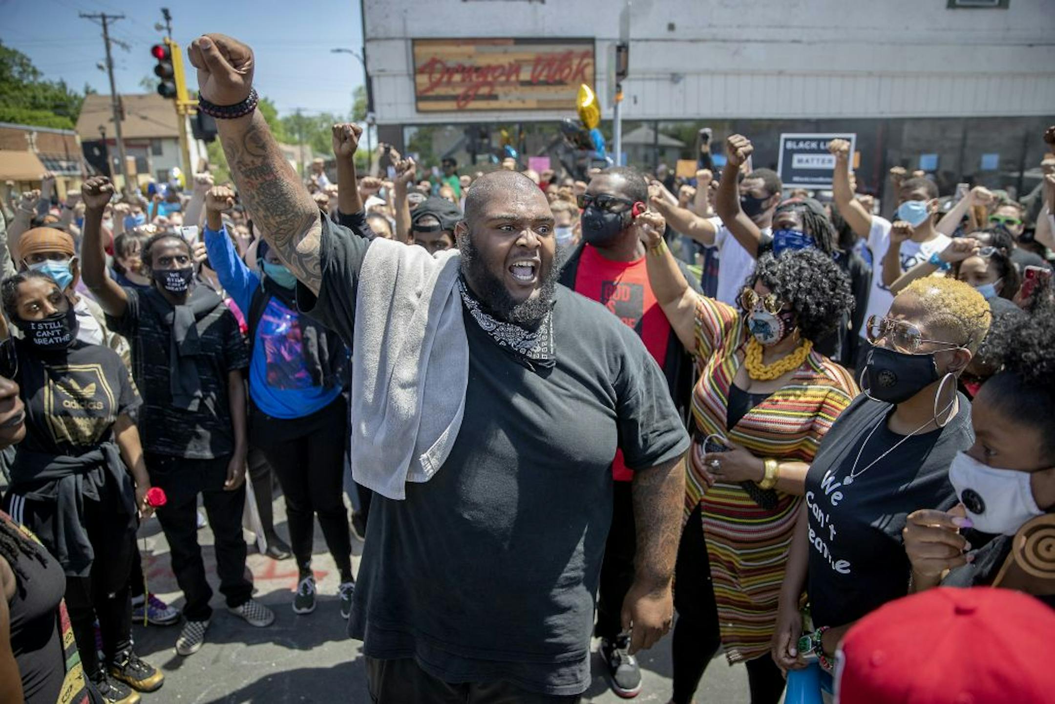 "Say his name!" yelled Michael Holiday as he led others on the corner where George Floyd was killed by a Minneapolis police officer at Chicago and 38th Street, Sunday, May 31, 2020 in Minneapolis.