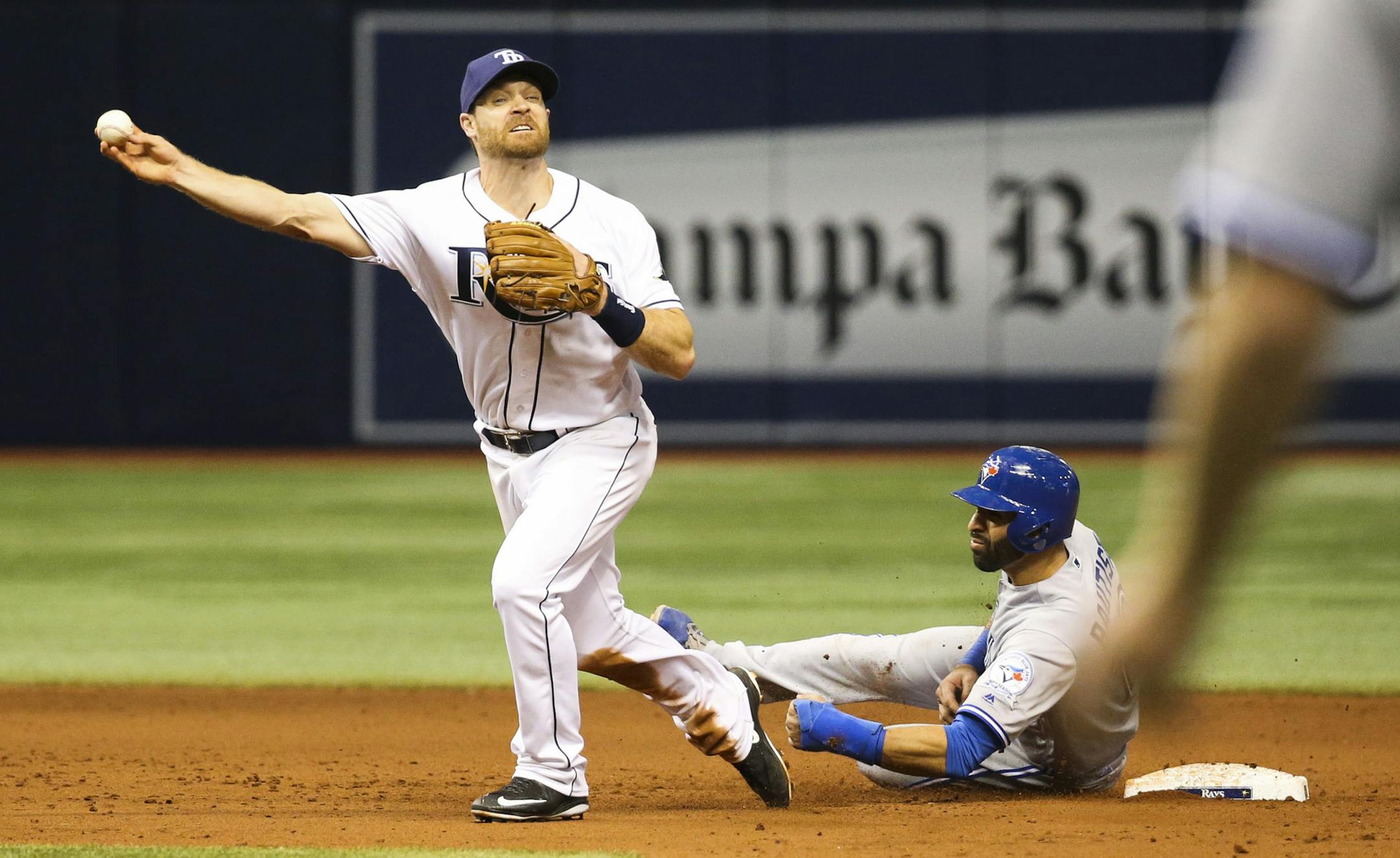 Toronto Blue Jays' Jose Bautista (19) interferes with Tampa Bay Rays second baseman Logan Forsythe as he looks to turn a double play on a ball hit by Edwin Encarnacion, that ended the baseball game after review, in St. Petersburg, Fla., on Tuesday, April 5, 2016. The Rays won 3-2. (Will Vragovic/The Tampa Bay Times via AP)