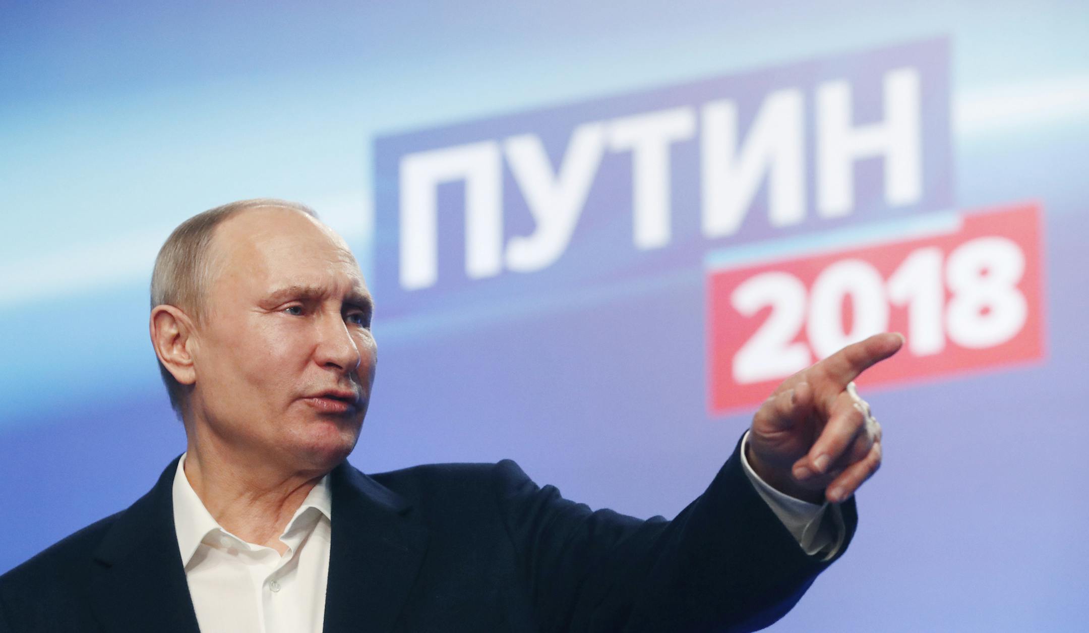 Russian President Vladimir Putin gestures during a news conference after meeting with his staff at the campaign headquarters in Moscow, Russia, Sunday, March 18, 2018. Russian President Vladimir Putin has dodged a question about his plans after serving another six-year term he has won. Putin wouldn't be eligible under the constitution to compete in the 2024 election since there is a limit of two consecutive terms. (Sergei Chirikov/Pool photo via AP)