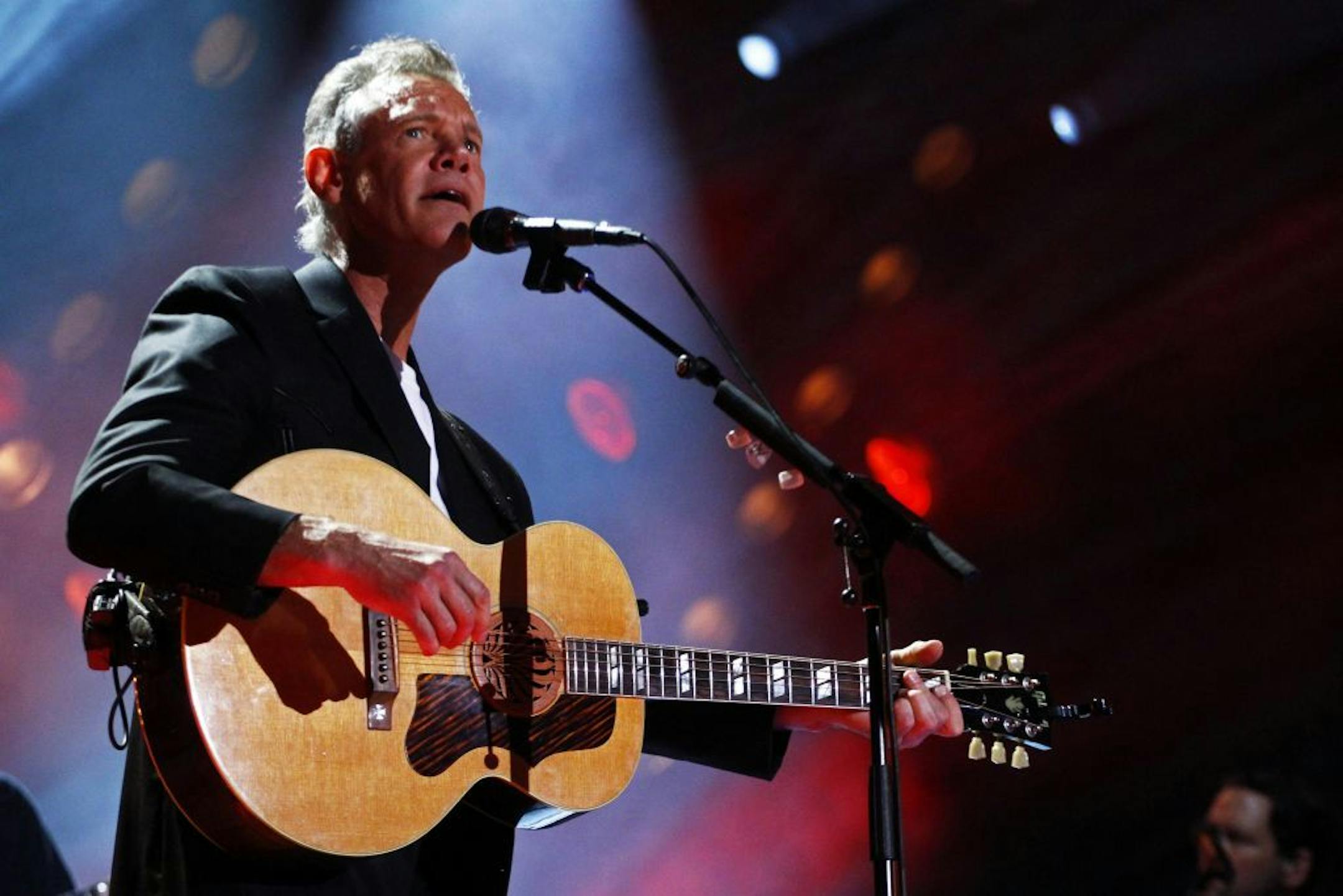 In this June 7, 2013, file photo, Randy Travis performs at the 2013 CMA Music festival at the LP Field in Nashville, Tenn. Travis has been hospitalized in Texas with viral cardiomyopathy.