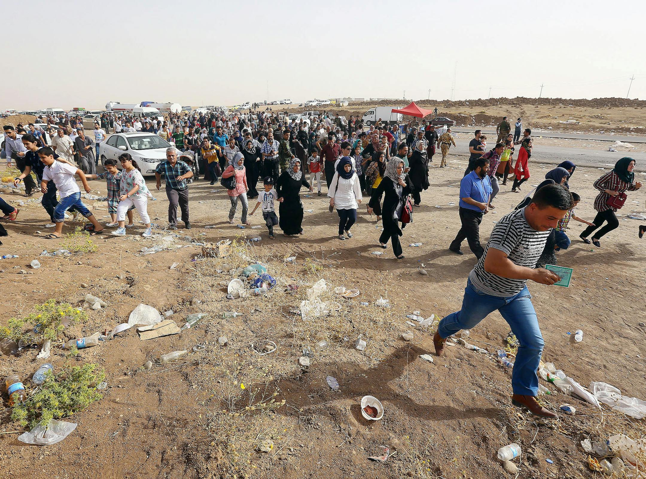 Refugees fleeing from Mosul head to the self-ruled northern Kurdish region in Irbil, Iraq, 350 kilometers (217 miles) north of Baghdad, Thursday, June 12, 2014. The Islamic State of Iraq and the Levant, the al-Qaida breakaway group, on Monday and Tuesday took over much of Mosul in Iraq and then swept into the city of Tikrit further south. An estimated half a million residents fled Mosul, the economically important city. (AP Photo)
