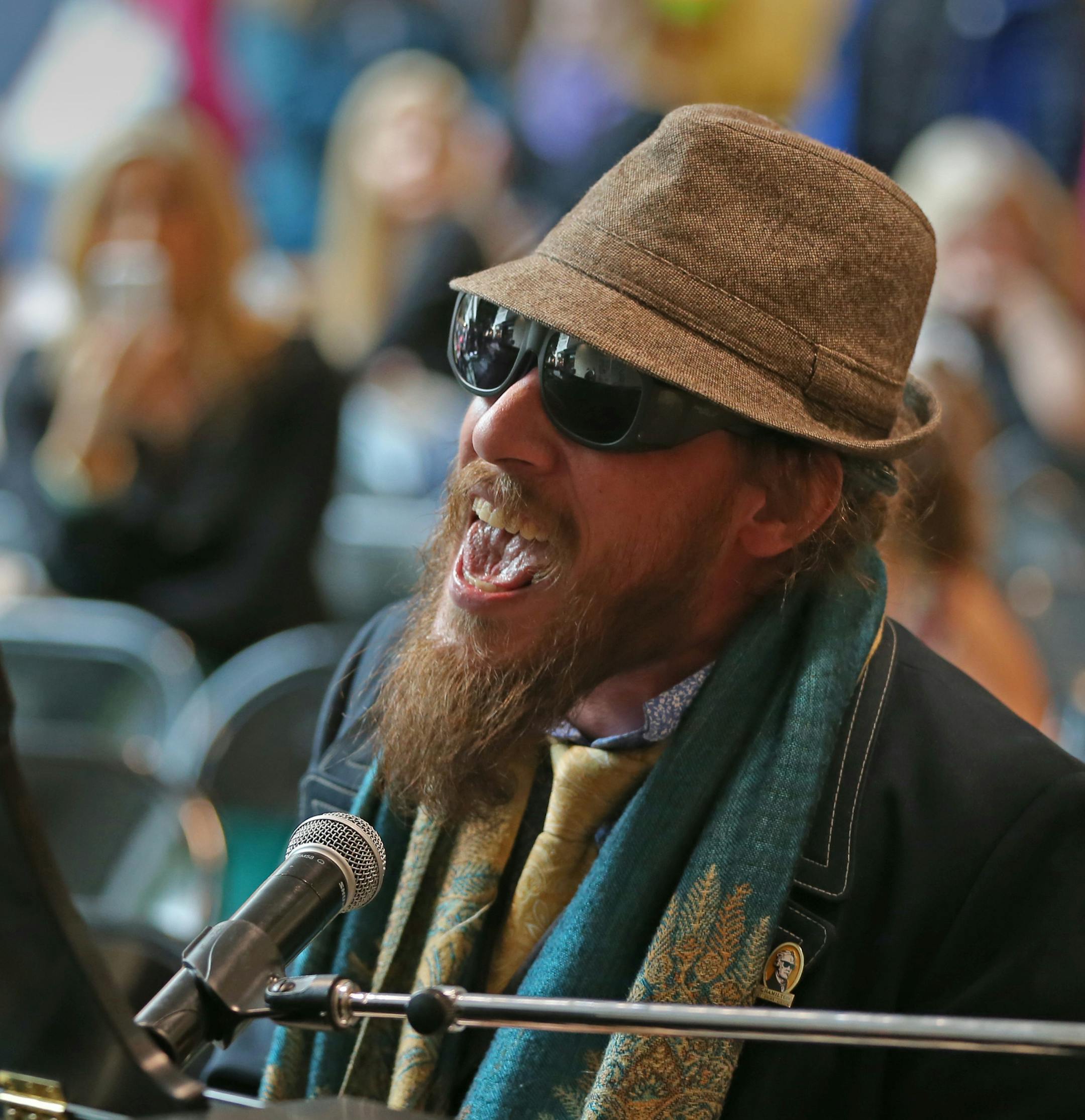 Nicholas David, 3rd place finalist for the 2012 session of "The Voice" sang for the audience at the Mall of America, after finishing his master of ceremony appearance at the MusicLink Playathon on 2/8/14. On the weekend of February 8 - 9 music students from around the state traveled to the Mall of America to participate in a MusicLink Playathon sponsored by Minnesota Music Teachers Association and Schmitt Music. The students performed in Nordstrom Court, raising money to benefit the MusicLink Fo