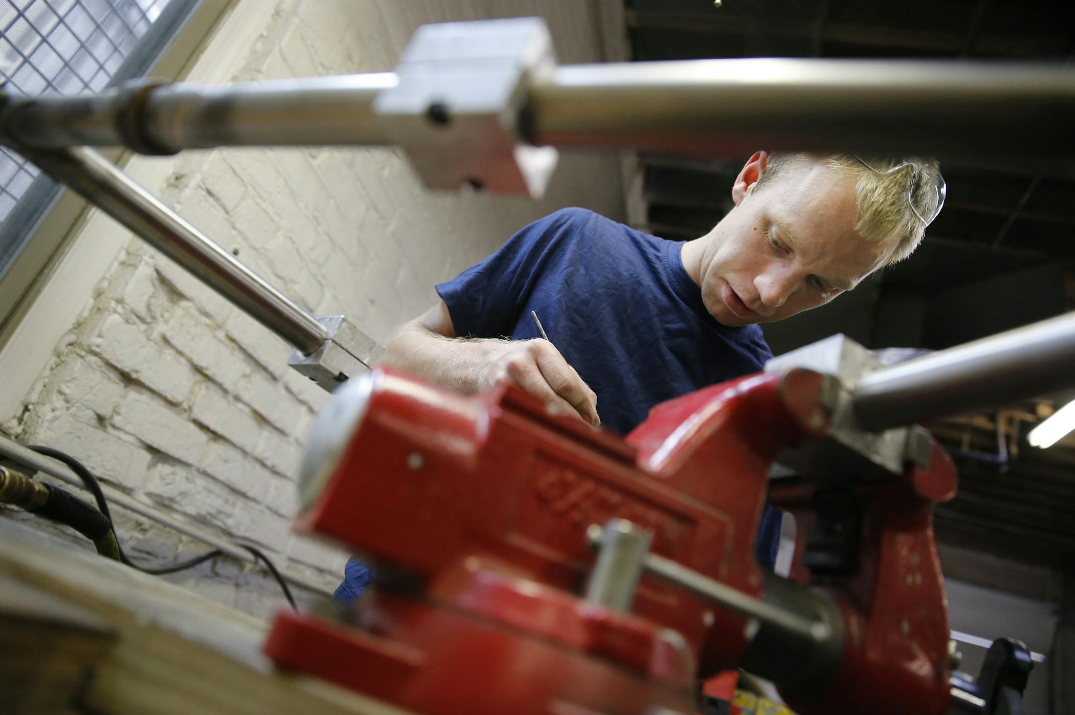 At his workshop in south Minneapolis, 25-year-old Alex Cook bike frame builder worked on a custom made stainless steel frames, his specialty. ] tsong-taataarii@startribune.com