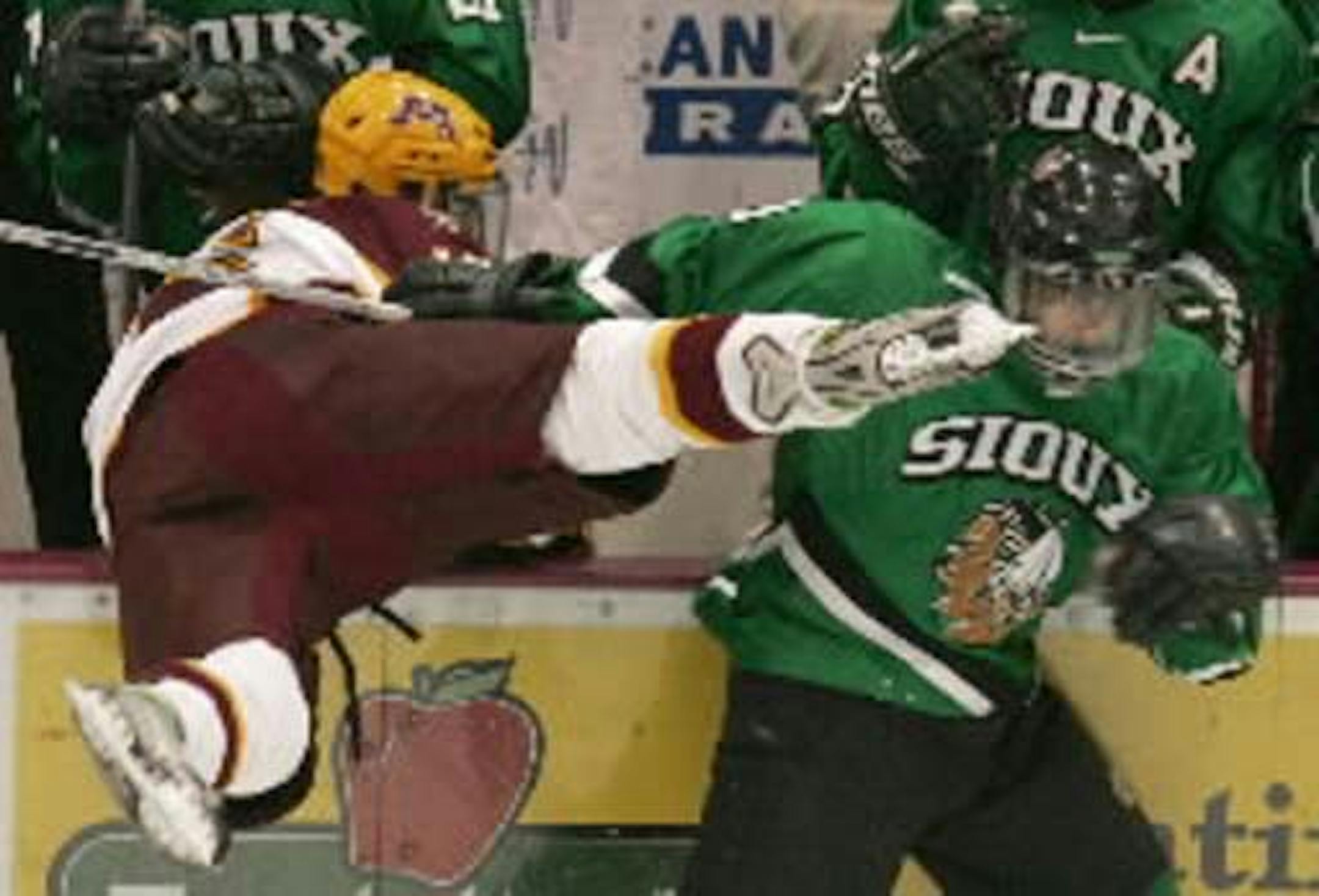 Minnesota and North Dakota often have spirited hockey meetings, such as this 2006 game with the Gophers' Ryan Potunly and the Sioux's Andrew Kozek tangling in front of the Sioux bench.