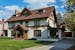 A 1915 Tudor Revival was updated with a video game room in the attic, an English pub in the basement and a chemistry-lab inspired remodeled kitchen, b