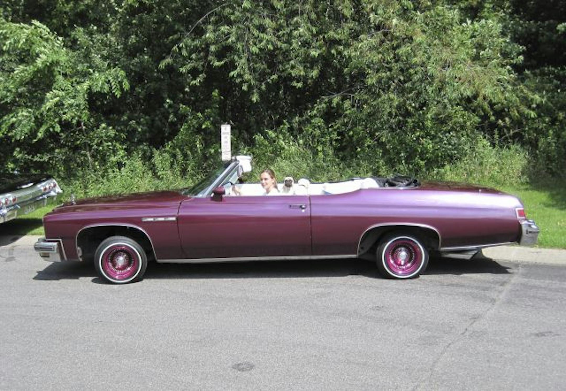 Erica Suski chills with her pet pug in her award-winning 1975 Buick LeSabre.