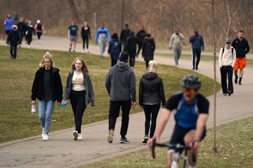 People flocked to Bde Maka Ska in Minneapolis despite officials urging social distancing to combat the spread of the coronavirus as temperatures crept