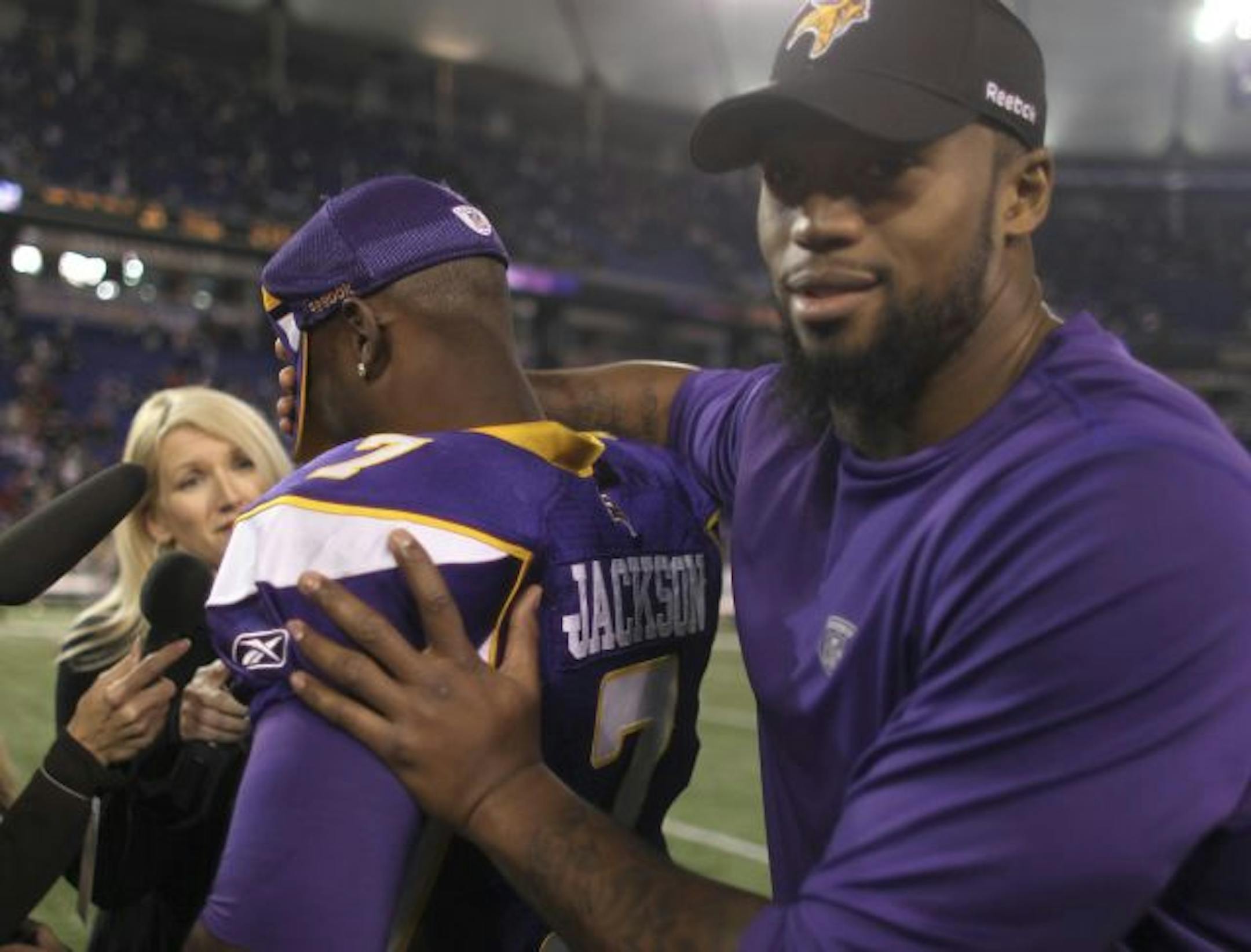 Vikings defensive end Ray Edwards (right, with Tarvaris Jackson) is moving ahead with a boxing career while the NFL stands still.