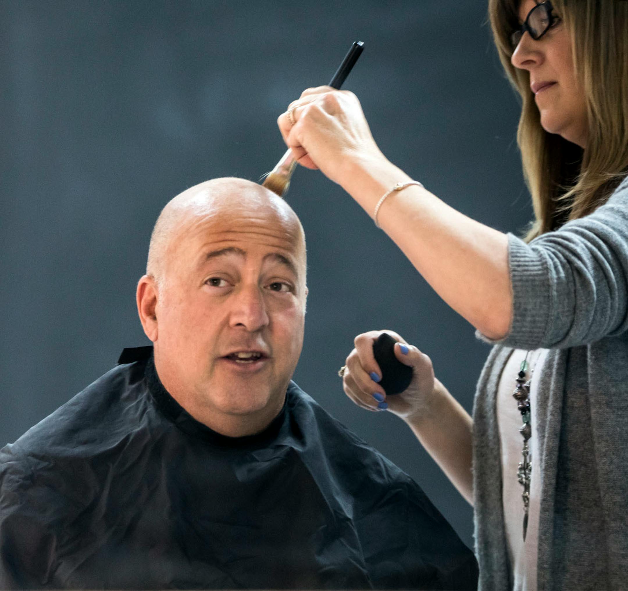 Make-up artist Pam Brand powdered Andrew Zimmern's head before a photoshoot for Midwest Living at Steve Henke Studio in Golden Valley, Minn., on Friday, May 26, 2017.