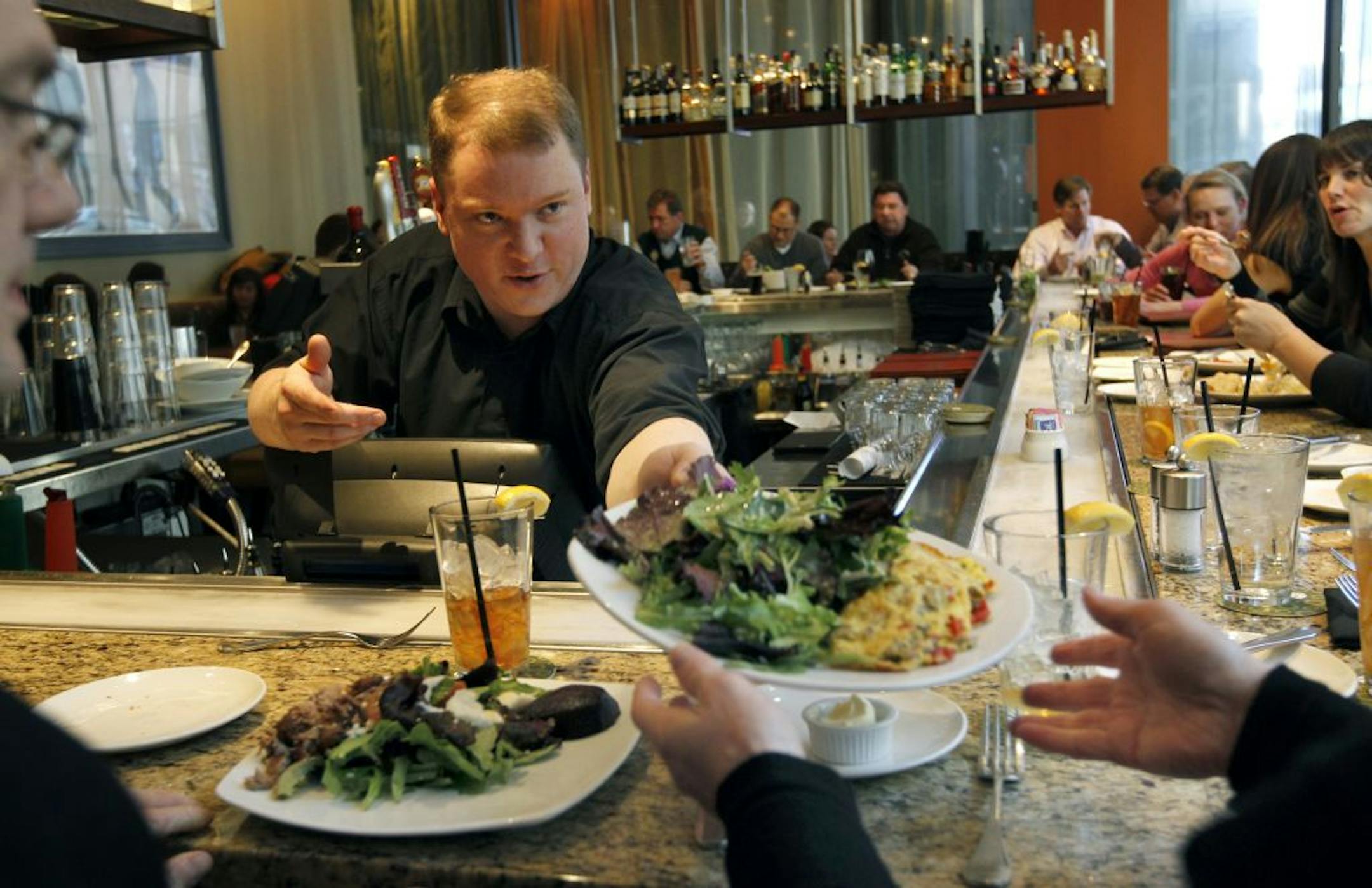 "The cellphone is kind of a get-you-out-of-anything excuse" when you're stuck in a bad conversation, says T.J. Akerson, bartender at Mission American Kitchen in Minneapolis.