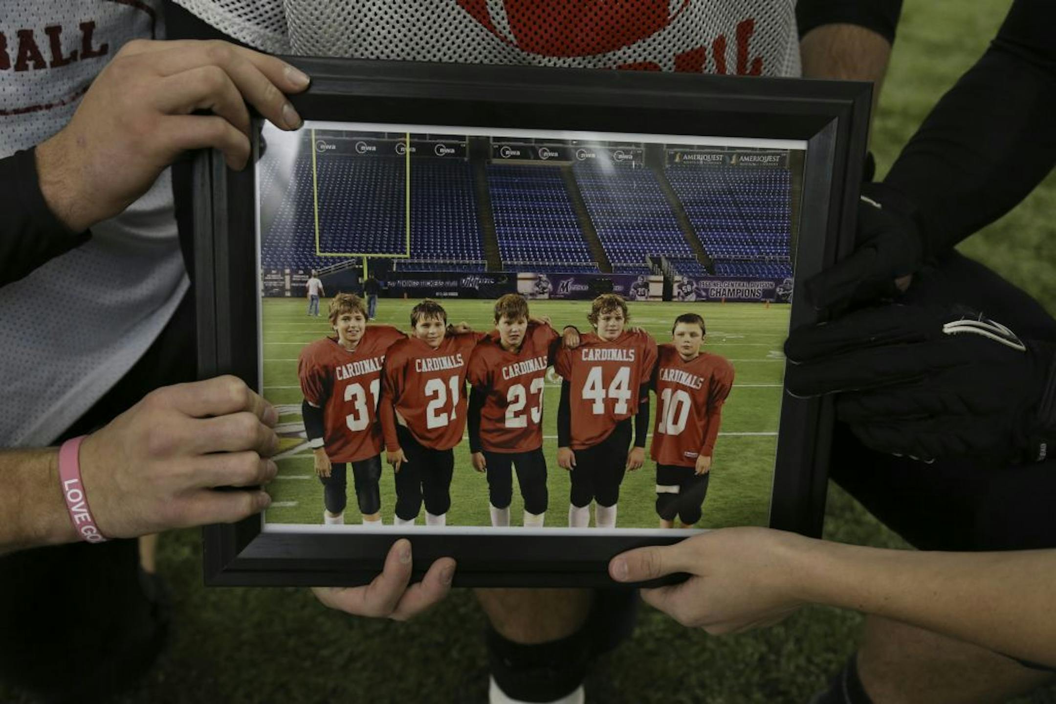 Bethlehem Academy seniors held a picture of themselves from left, Tim Angell, Matt Siegfried, Joe, Zweber, Dylan Valentyn and Jacob Kuhlman.