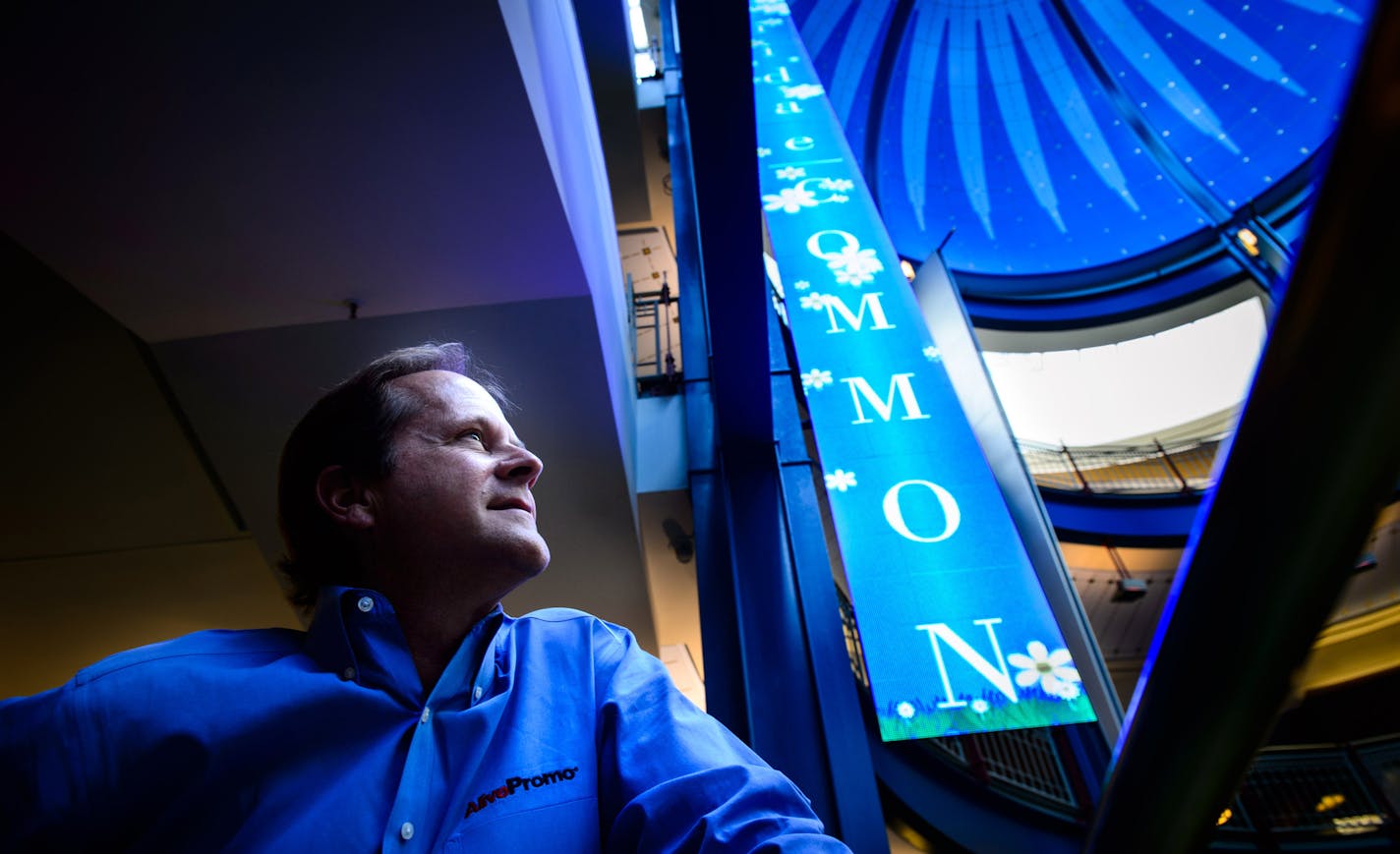 Sam Rogers , CEO of AlivePromo in Gaviidae Common showed his 40 ft LED banners and interactive HD screens and an interactive puzzle. ] Monday, May 5, 2014 GLEN STUBBE * gstubbe@startribune.com